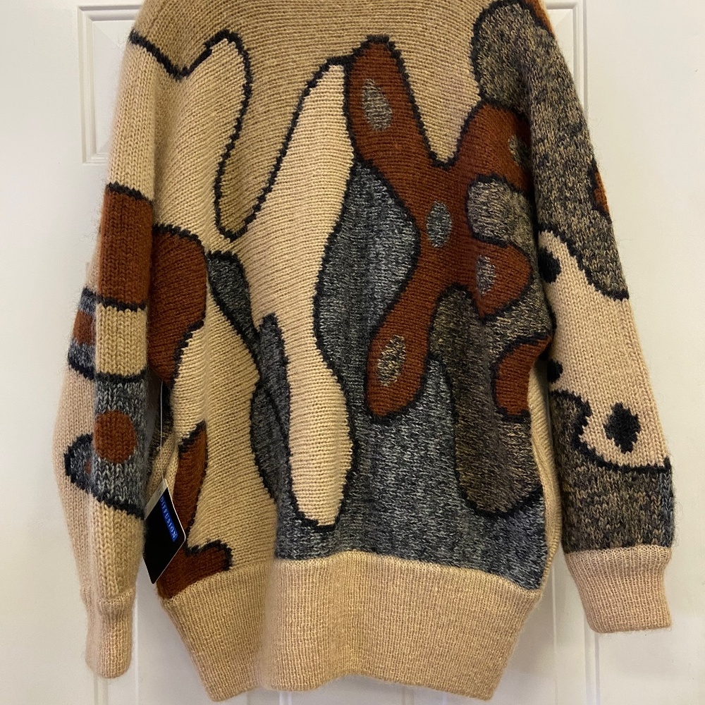 A medium warm wool button up sweater.